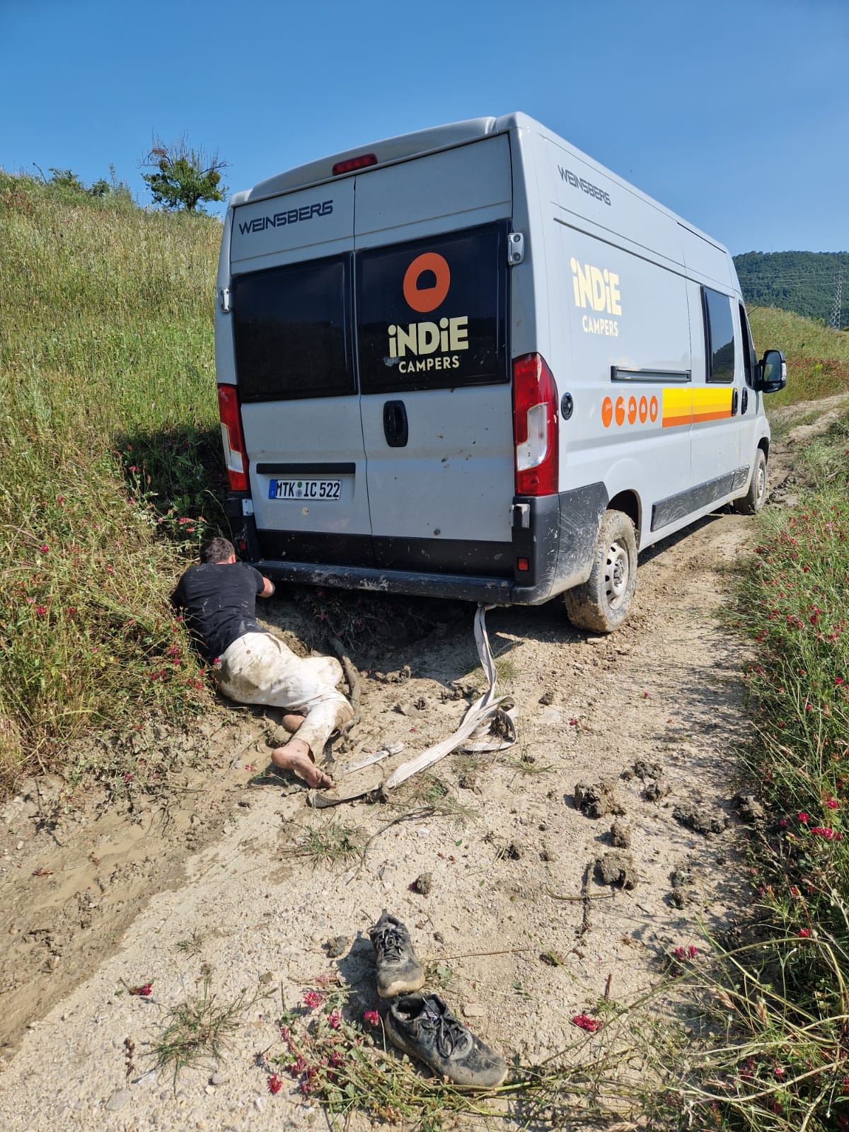 Camper van stuck in the mud